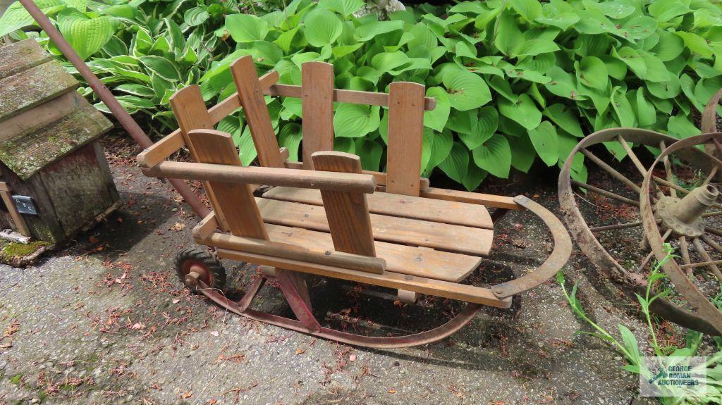 Vintage infant sled with wheels and handle