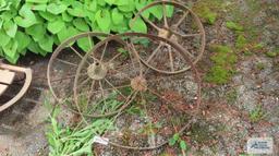 Three antique metal wheels