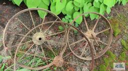 Three antique metal wheels