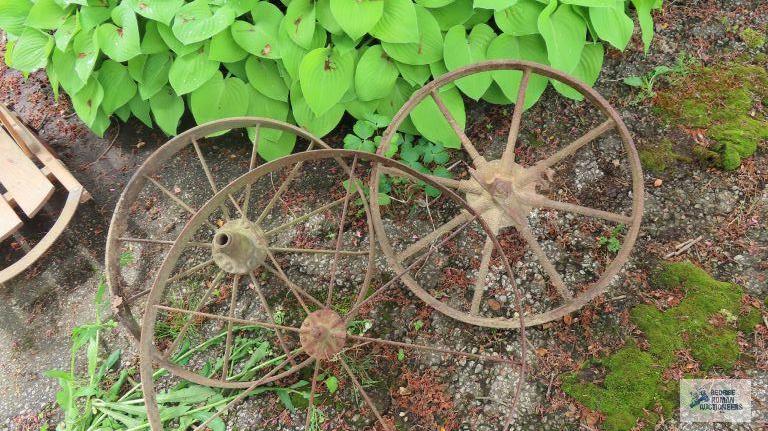 Three antique metal wheels