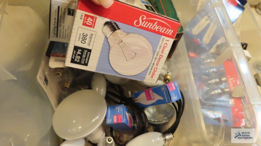 Assorted lightbulbs in totes