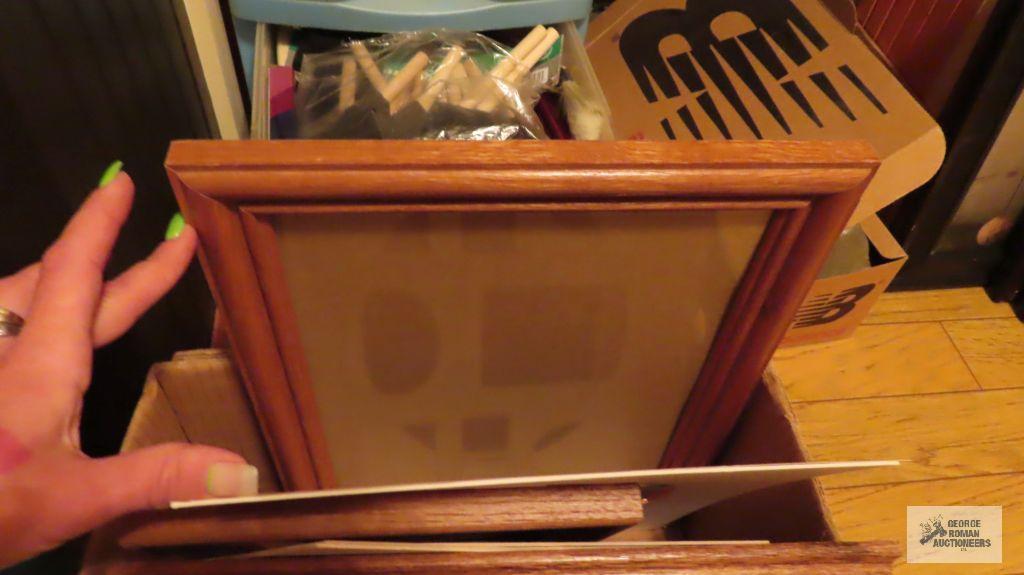 Variety of craft items and various frames. Includes rolling plastic storage cabinet