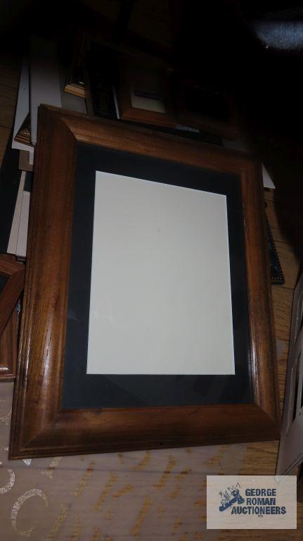 Large variety of picture frames, mostly wooden