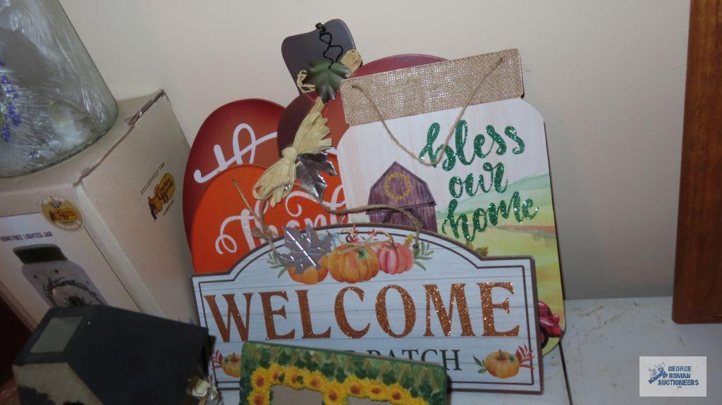 Variety of fall decor, Lighted jar, Candle holders,...and group of pictures.