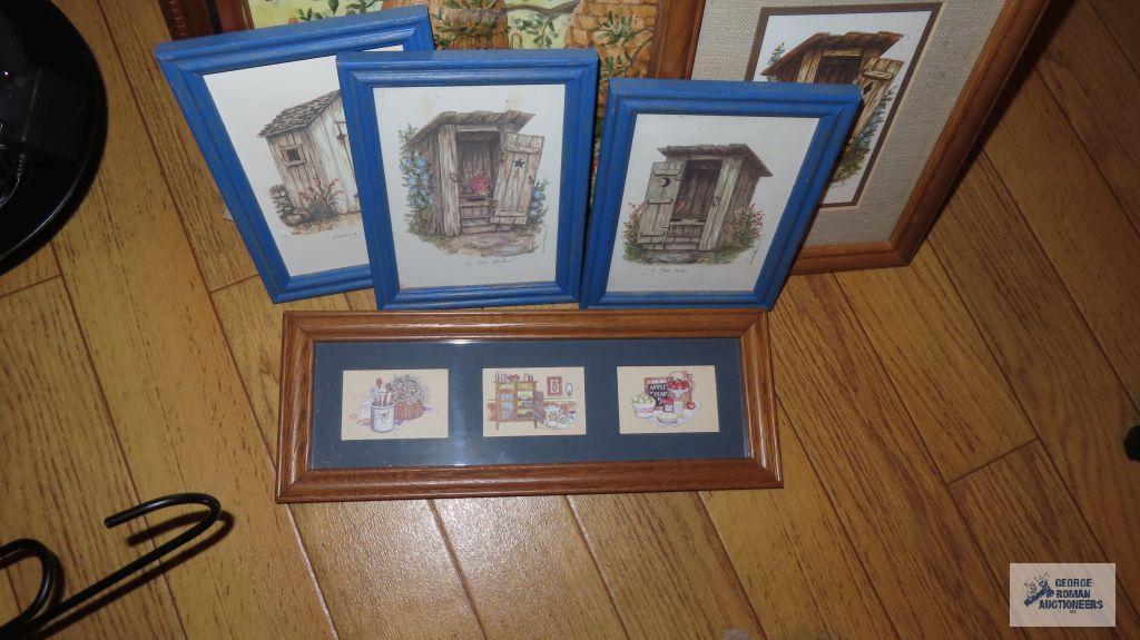 Variety of decorative prints in wooden frames