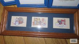 Variety of decorative prints in wooden frames
