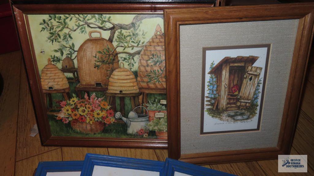 Variety of decorative prints in wooden frames