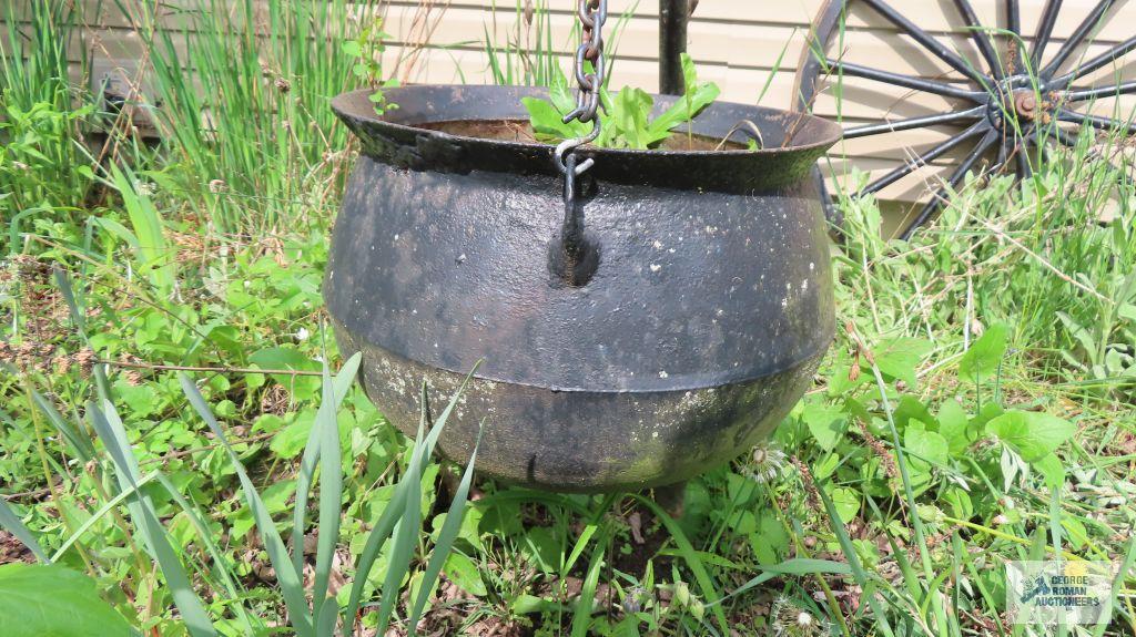 Cast iron cauldron with tripod