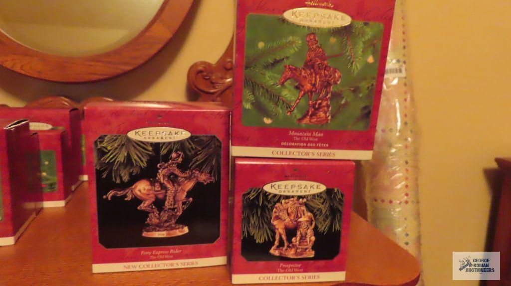 Three Hallmark keepsake ornaments of the old west collector series, including Prospector. Mountain