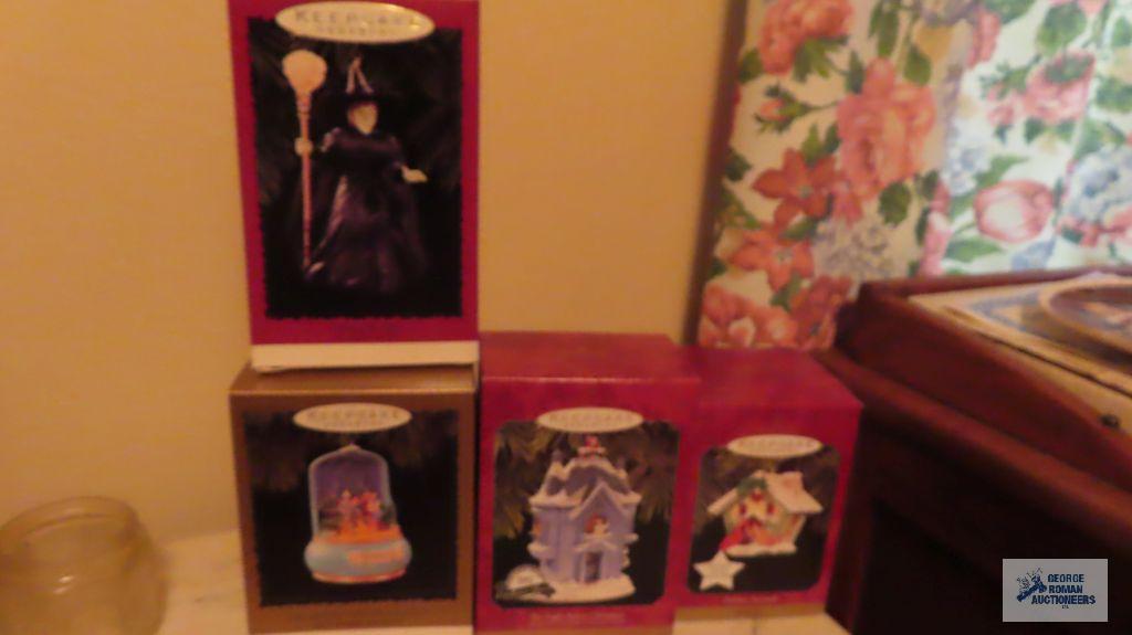 Four Hallmark keepsake ornaments that are musical