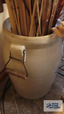 Crown 6 gallon crock with wire handles and contains reeds