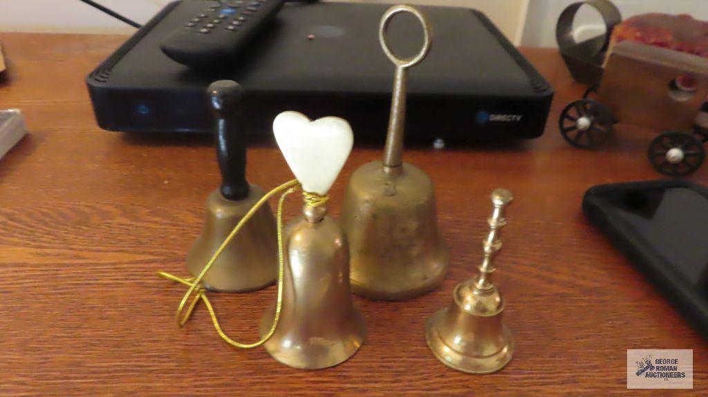 Four brass bells