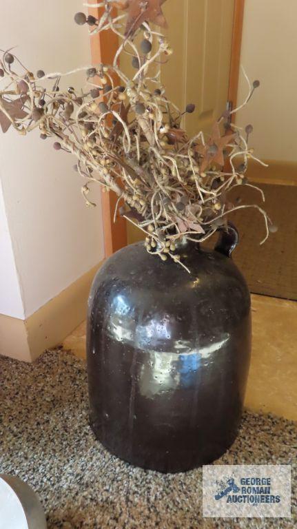 Dark jug with arrangement