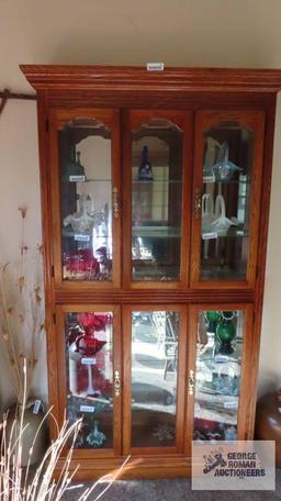 Oak lighted curio cabinet, all glass sides