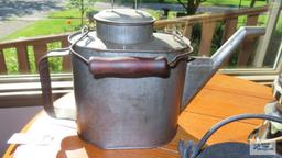 Tin container with handle, lid and spout