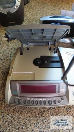 GE digital CD clock radio, Sony dream machine, and Sharp alarm clock