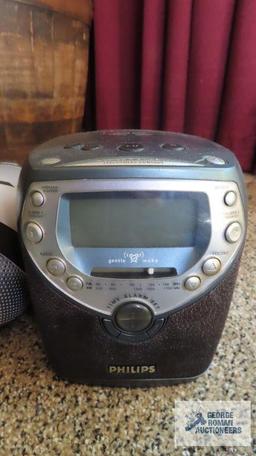 Phillips compact disc clock radio and Magnavox compact disc digital audio boombox