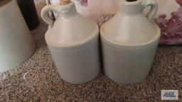 Two small jugs, one with cork
