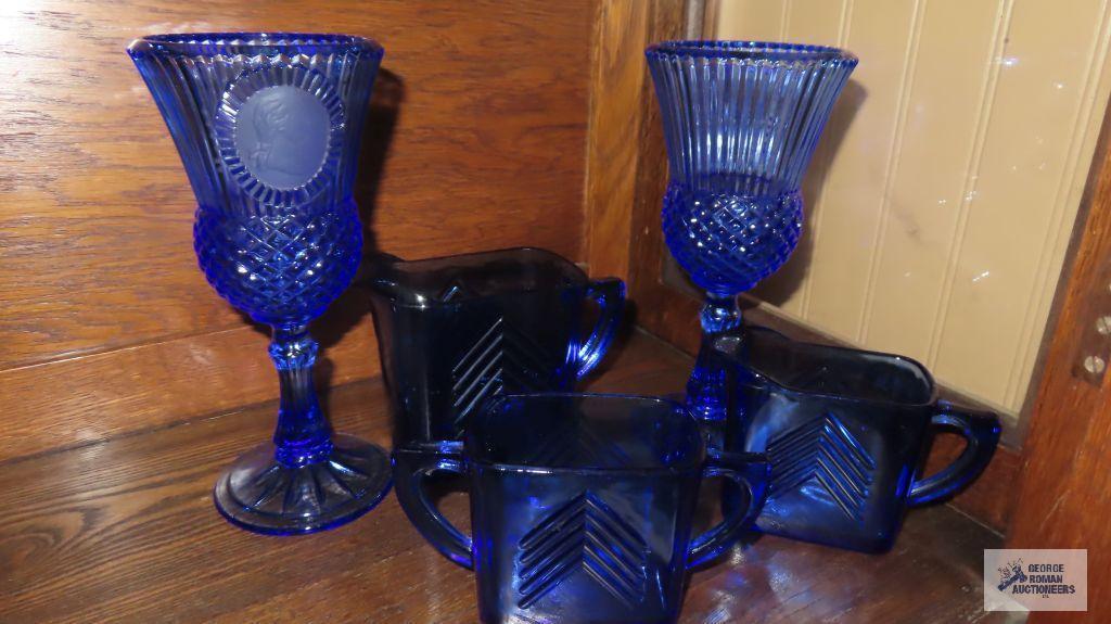 Cobalt blue creamer and sugars and blue goblets