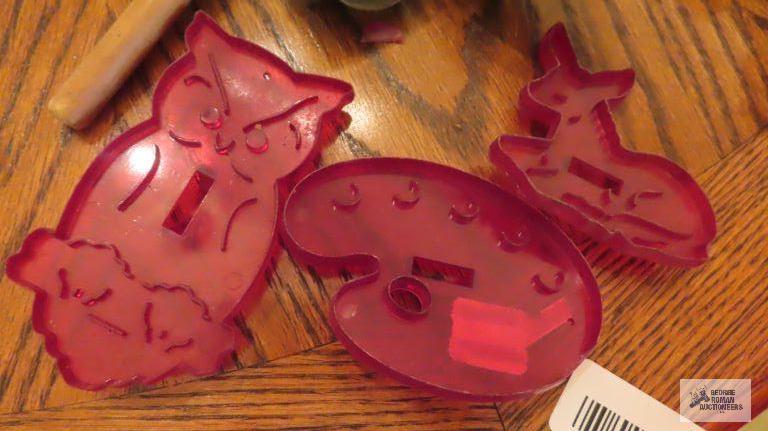 Metal and plastic cookie cutters and mallet