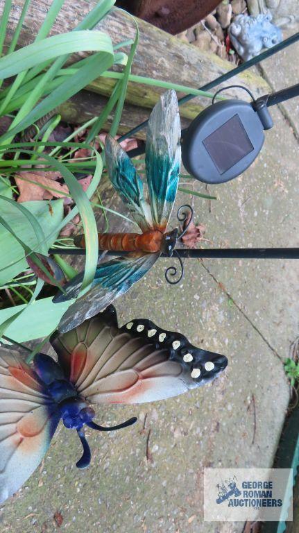 Lot of solar powered lighted yard decorations and butterfly yard decorations