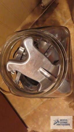 Glass jar with cookie cutters