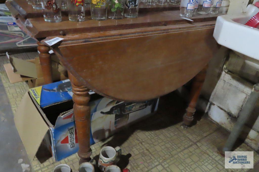 Drop leaf table with three leaves, needs refinished and formica...top table with one leaf