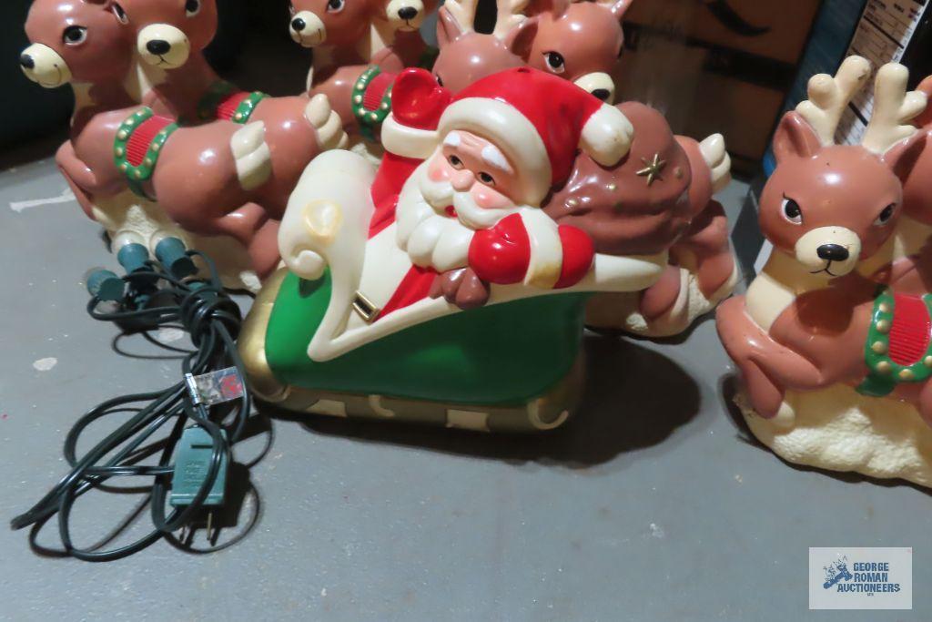 Santa Claus sleigh and reindeer plastic lighted decoration and snowman lights
