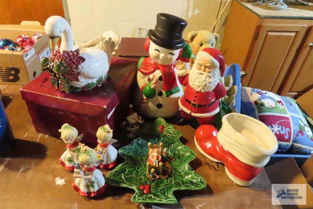 Christmas decorations including angels, holly plate, Santa boot, Sana snowman