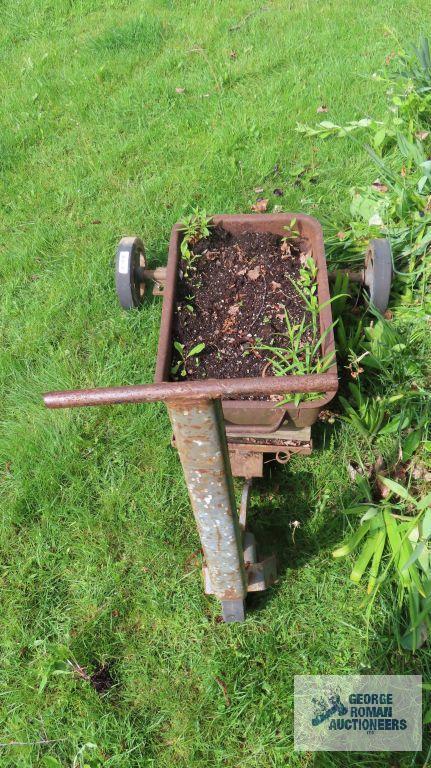 Antique industrial roll about cart with planter