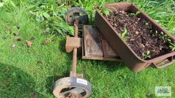 Antique industrial roll about cart with planter