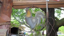 Antique rug beater and rooster decoration