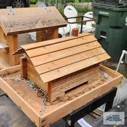 Two wooden bird feeders