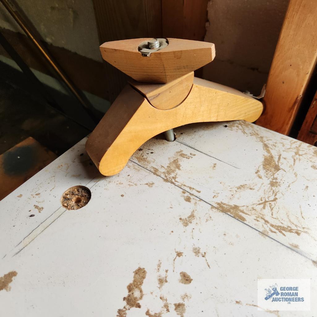 Homemade router table and workbench with wooden top and metal frame