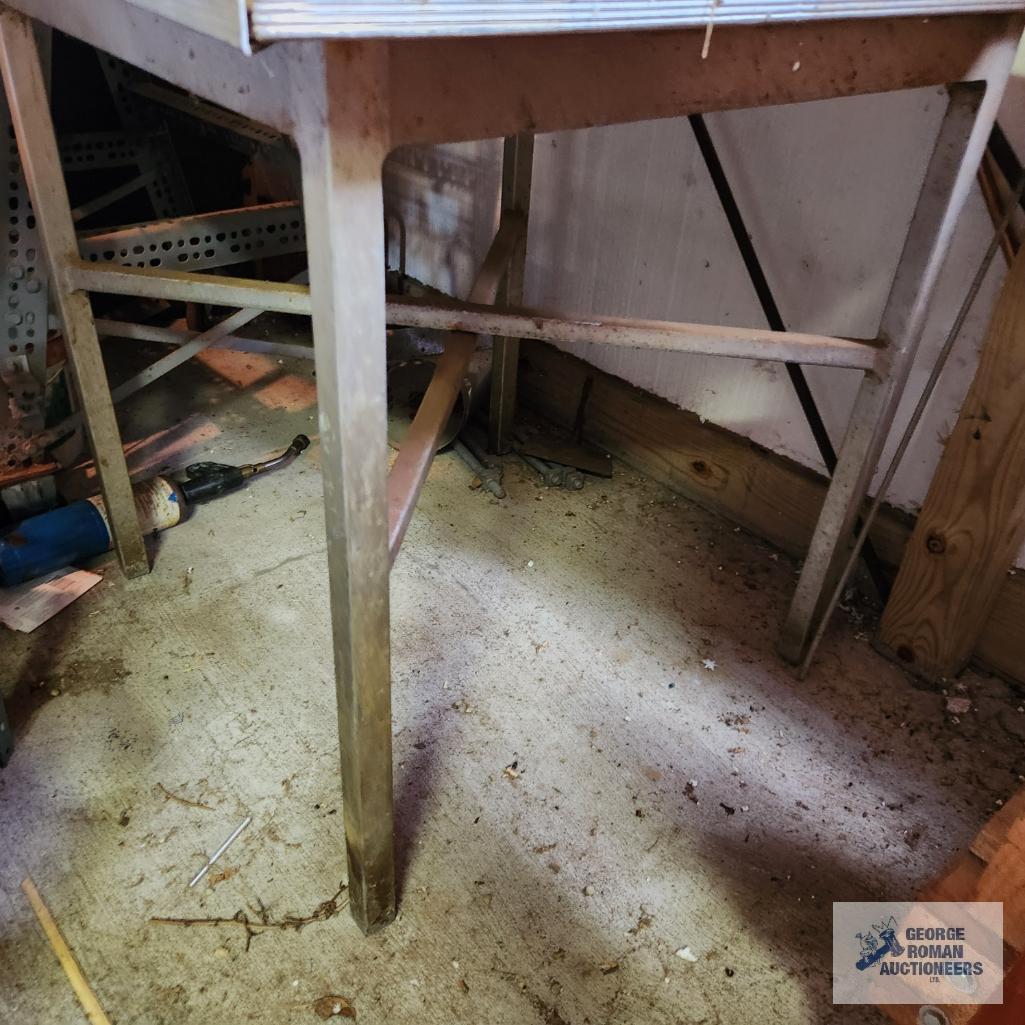 Homemade router table and workbench with wooden top and metal frame