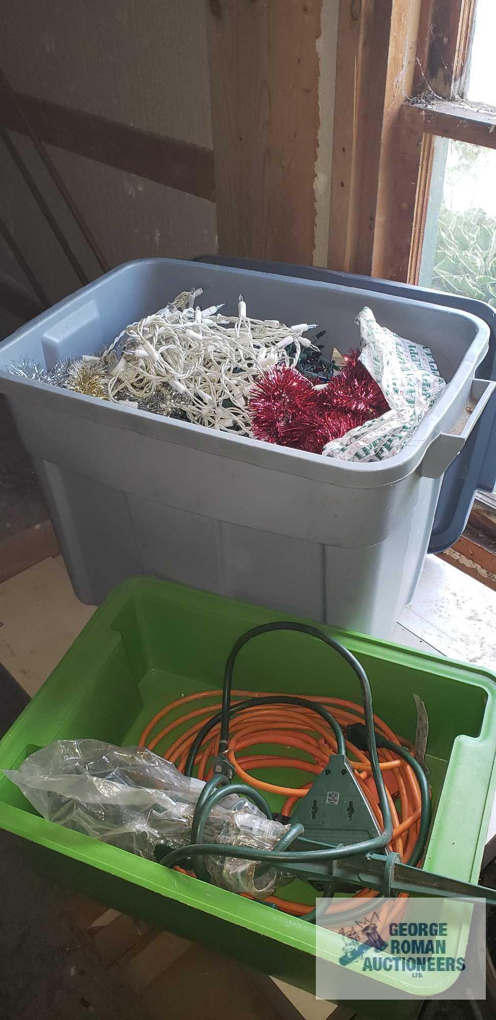 Tote of Christmas lights and garland and other plastic bin with electric cords