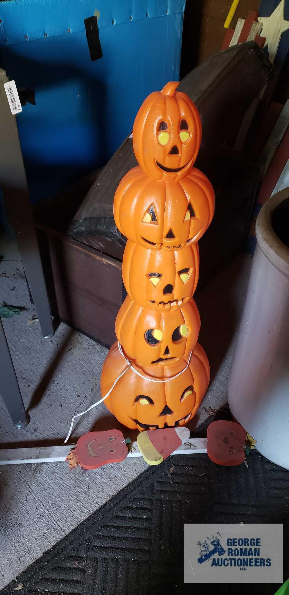 Lighted pumpkin and wooden Halloween decoration