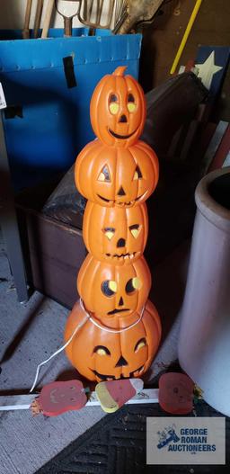 Lighted pumpkin and wooden Halloween decoration