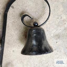 Two small bells. One has a hanger