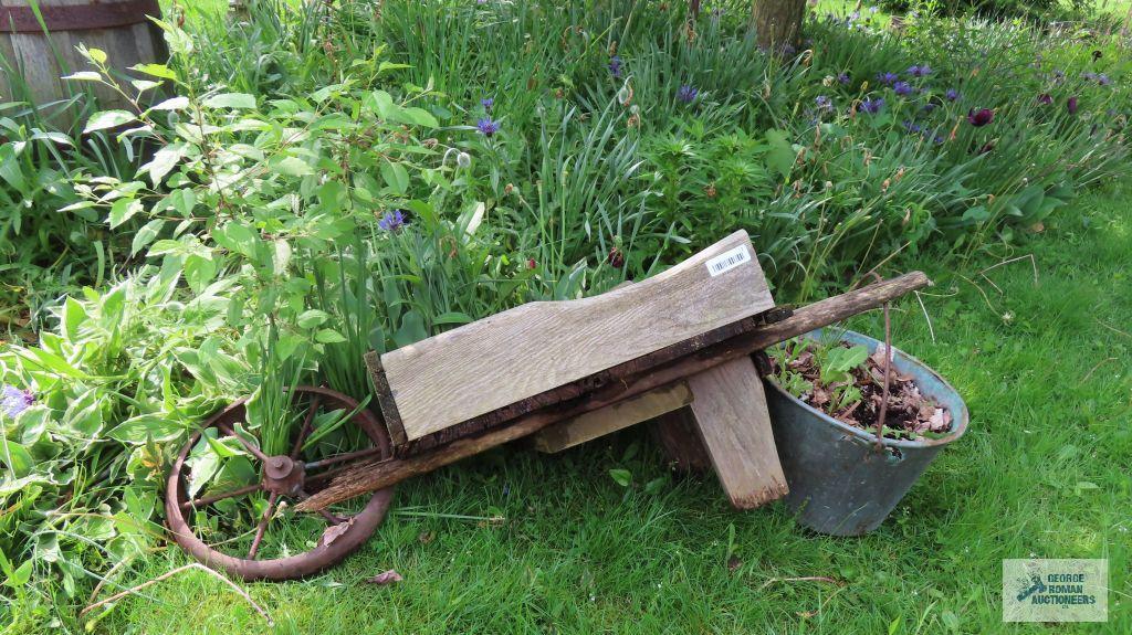 Antique wheelbarrow with copper bucket