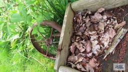 Antique wheelbarrow with copper bucket