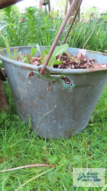 Antique wheelbarrow with copper bucket