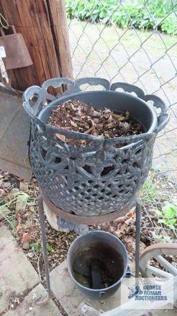 Cast iron cauldron and cast iron planter with stand