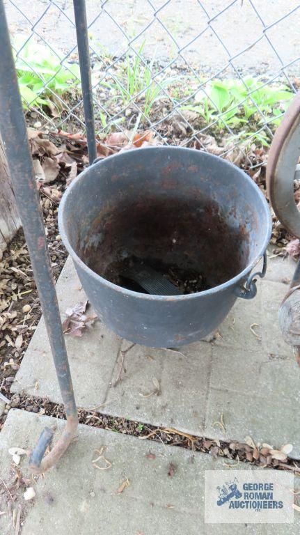 Cast iron cauldron and cast iron planter with stand