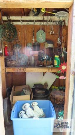 Contents of outhouse including hanging baskets, plastic planter inserts, small plant hooks, garden