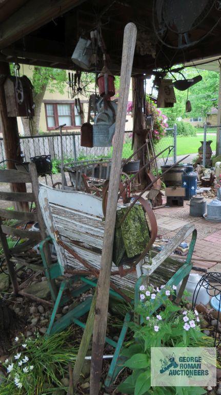 Lot of wooden and metal chairs, birdhouse, pitchfork, and children swings