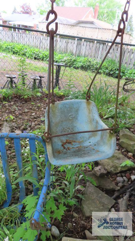 Lot of wooden and metal chairs, birdhouse, pitchfork, and children swings