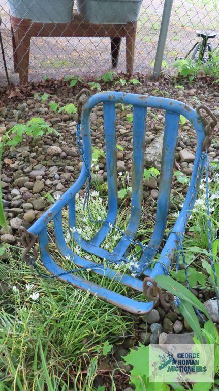 Lot of wooden and metal chairs, birdhouse, pitchfork, and children swings