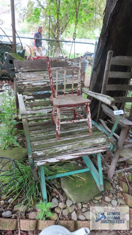 Lot of wooden and metal chairs, birdhouse, pitchfork, and children swings