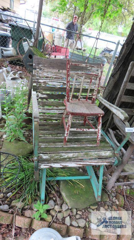 Lot of wooden and metal chairs, birdhouse, pitchfork, and children swings